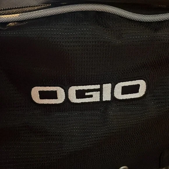 New OGIO sports illustrated black and gray duffle bag with shoulder strap.